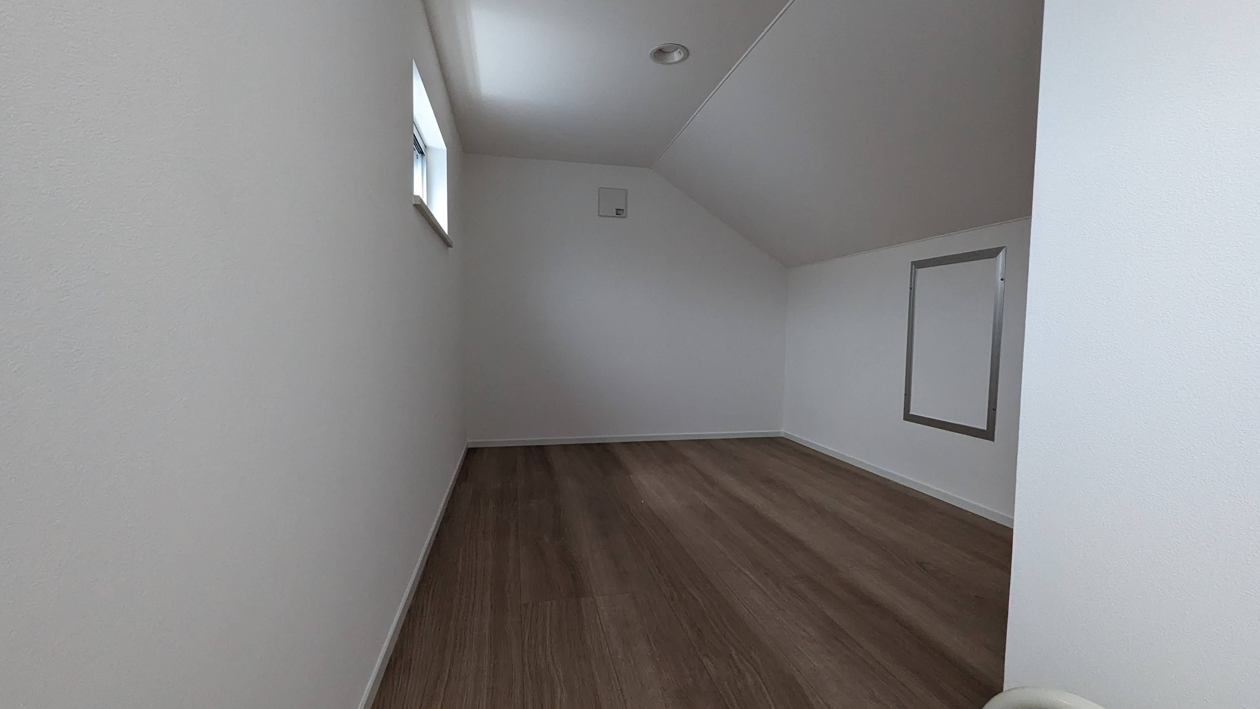 Room with a sloped ceiling in one of the houses we saw